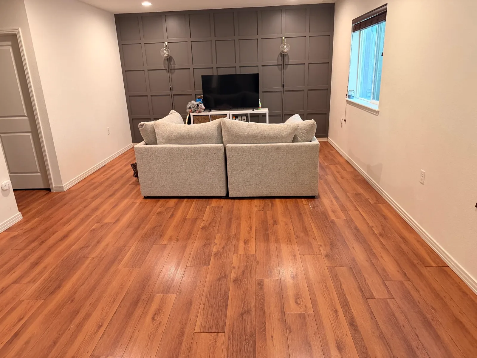 Warm cherry-look luxury vinyl plank in a living room