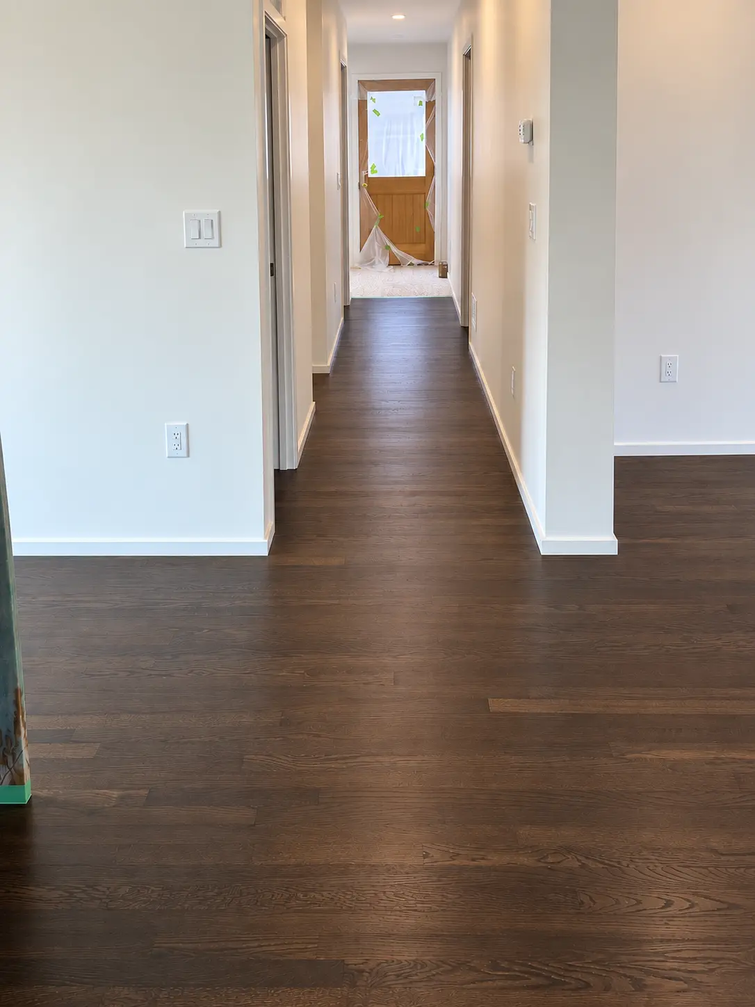 Dark walnut-stained hardwood hallway