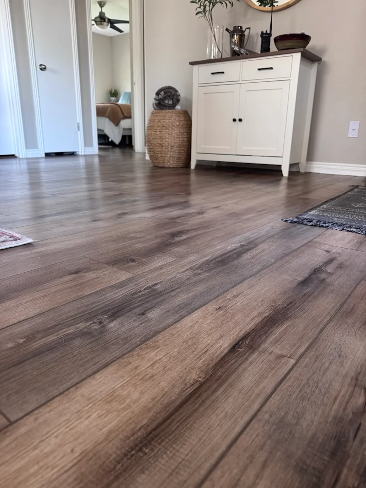 Dark wood-look luxury vinyl plank flooring in a living room