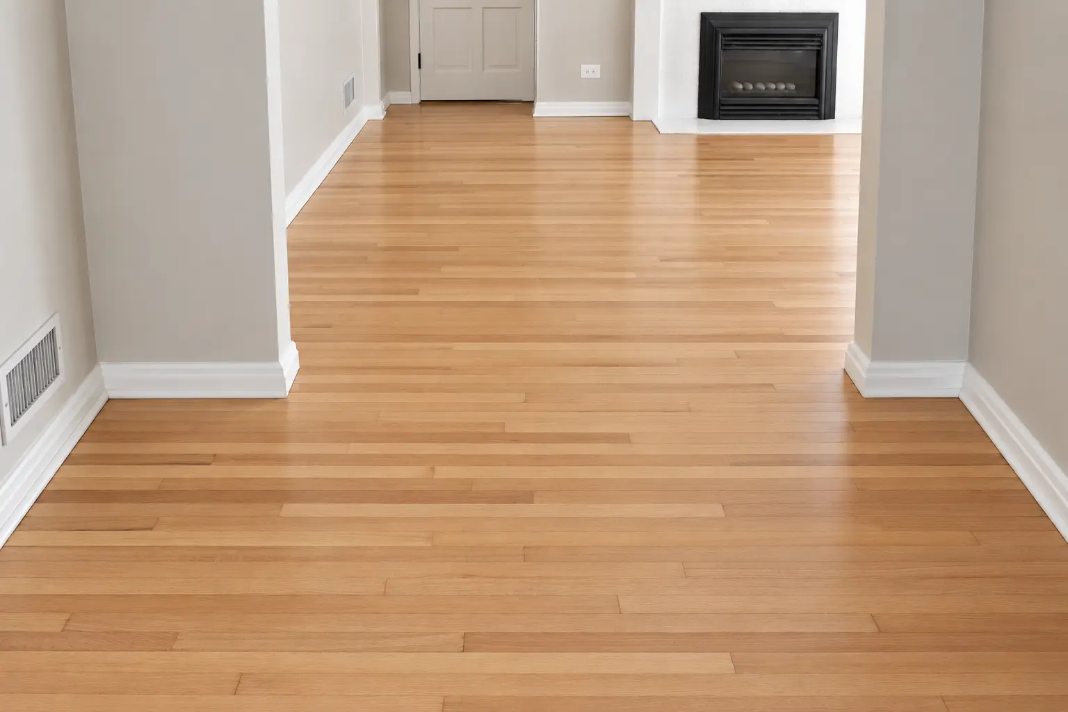 Light oak hardwood floor in a room with a fireplace