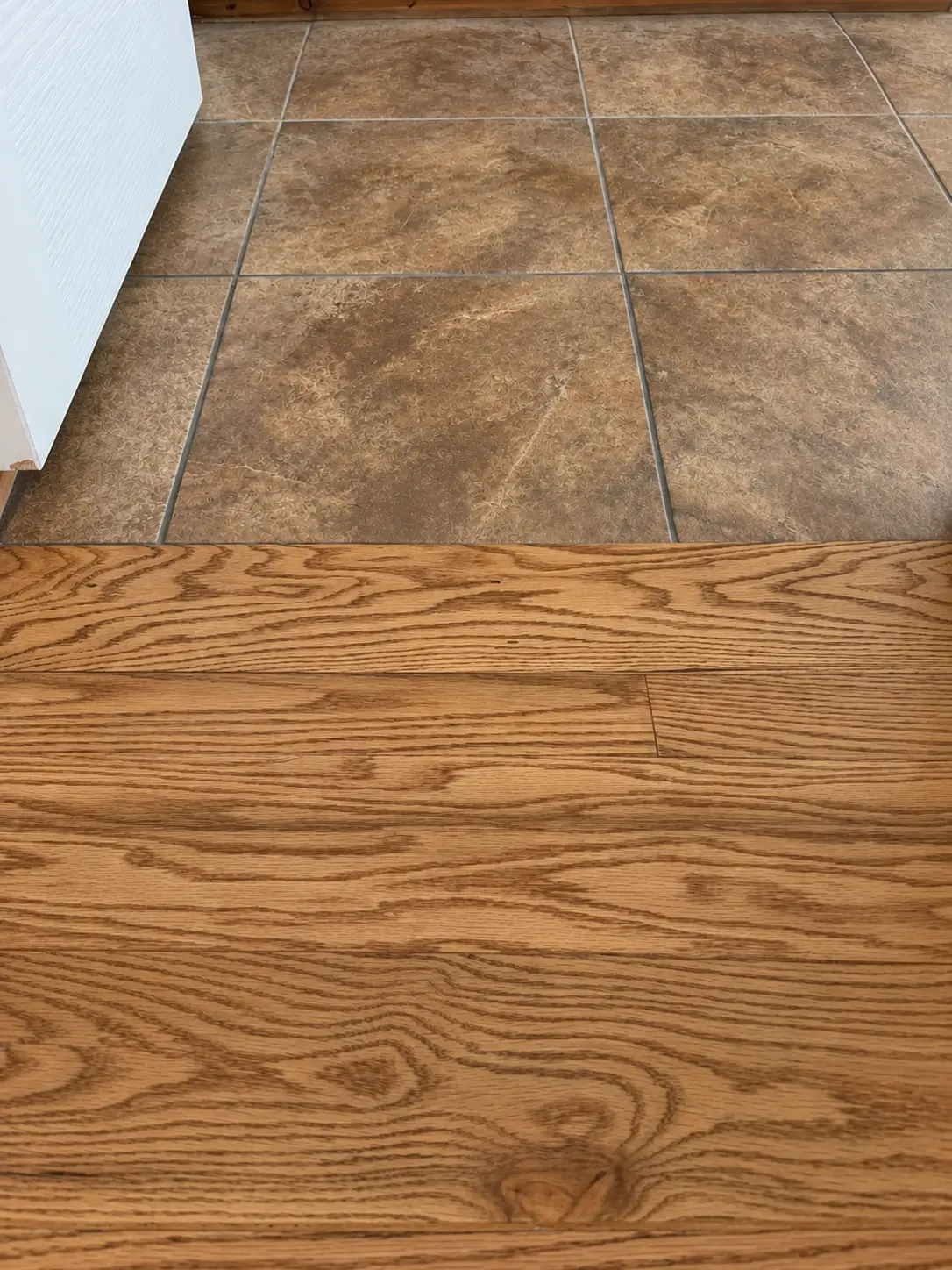 Seamless tile-to-oak hardwood floor transition